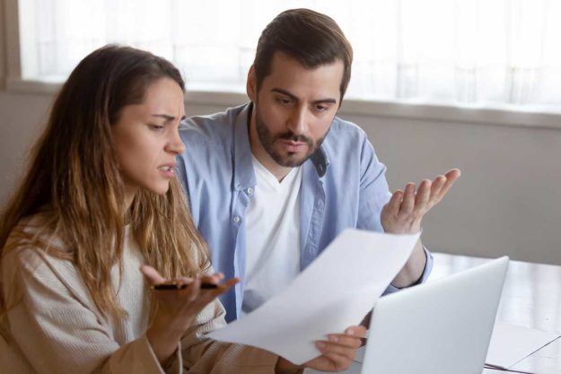 tax-season-mistakes people looking over tax season mistakes
